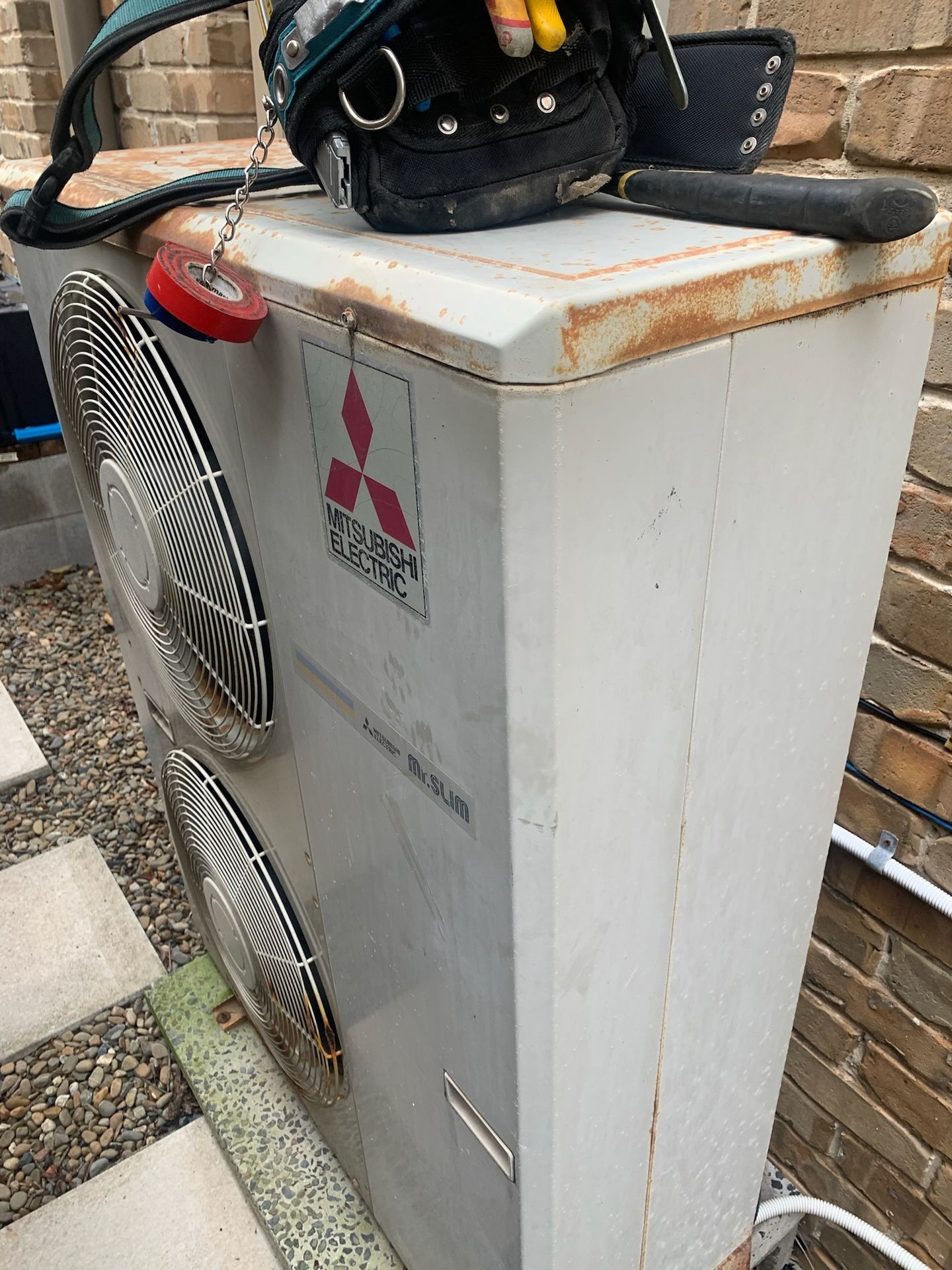 Tools on top of an old air conditioner