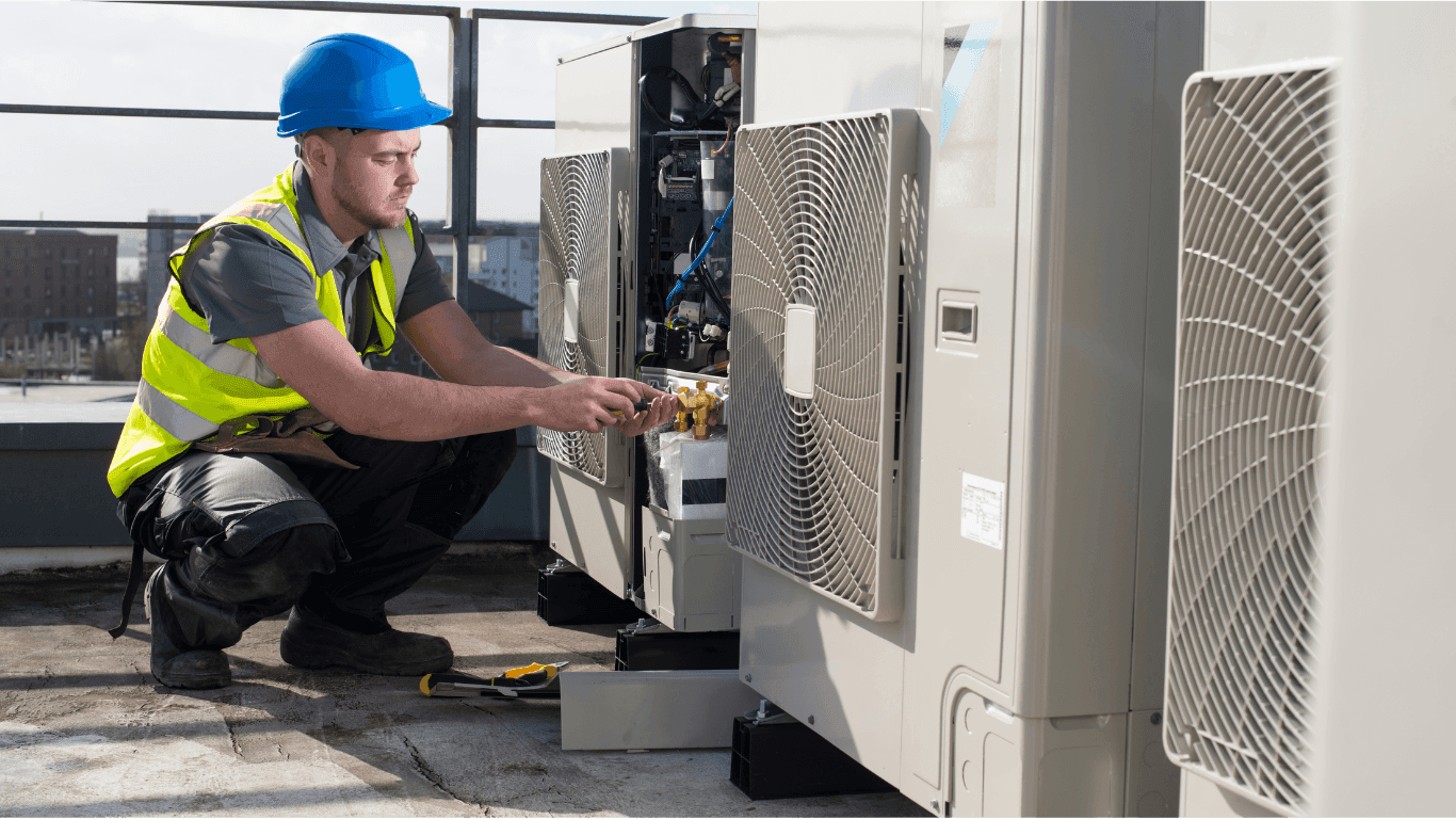 Air Conditioning Technician working on a commercial air conditioner